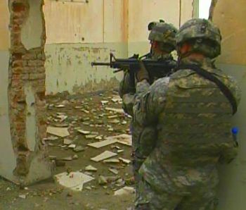 American soldier raises his weapon on patrol in Kabul, Afghanistan, Nov. 2006