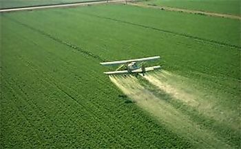 Cropduster spraying pesticides