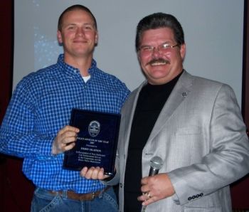 Chief Adams of Keizer Police presenting Officer Olafson with the Police Officer of the Year Award 