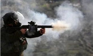 Israeli soldier firing weapon