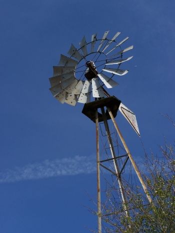 Windmill in Oregon from another era that still functions today; wind power is one example of things the group is looking at to improve efficiency and offset the soaring cost of traditional power.  Photo by Bonnie King Salem-News.com