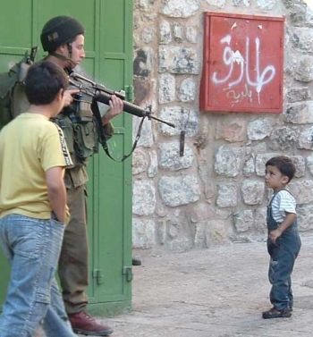 One of so many published photos of the real story in Palestine, and Israel's version of a Palestinian terrorist.