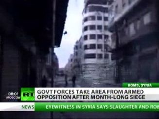 Members of the Free Syrian Army patrol an area in Qusayr