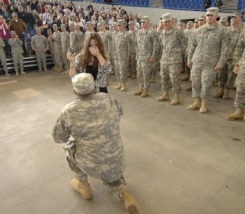 Oregon soldier, Garen Hart, of Sherwood, Ore., proposes to his fiancé, Melinda Morris, of Portland