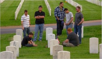 Sgt. Jacob Blaylock, seated left, one of four in his Guard unit to commit suicide