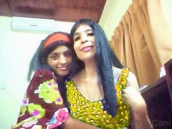 Amala and Sadia Khan in a webcam photo taken at an undisclosed location.