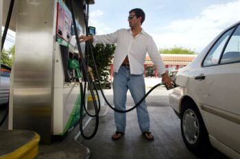 man pumping gas