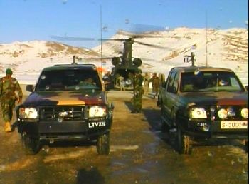 The trucks in the foreground are American purchased Ford Rangers used by the Afghan Army, an example of the one way spending that the taxpayer is paying for.