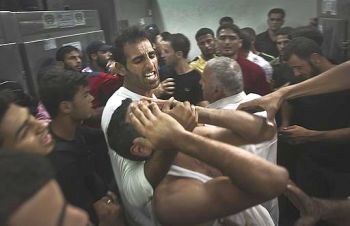 Gaza men in anguish after Israeli attack killed loved ones.