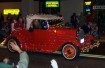 red car in lighted parade