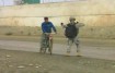 soldier stops bicycle